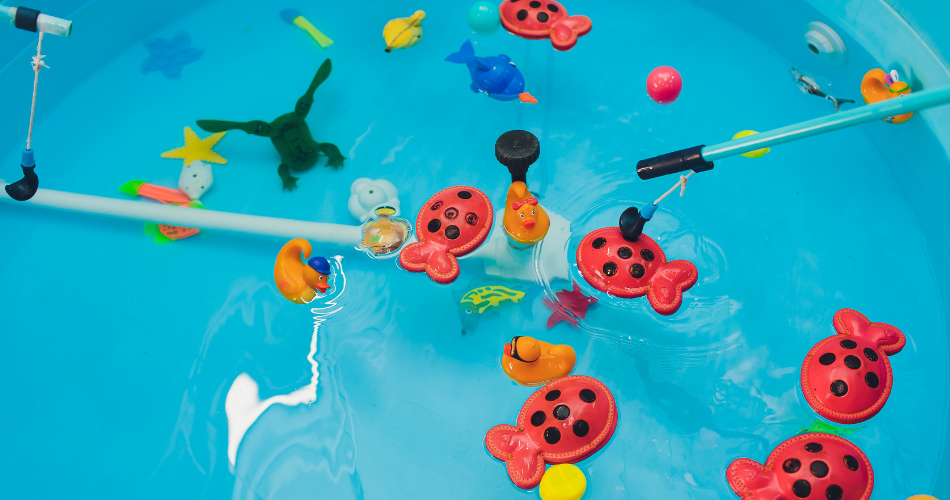 blue paddling pool filled with toys