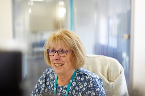 Bristol Water employee sits at desk