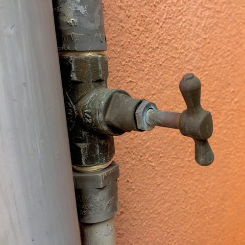 Stop tap on a pipe in a garden