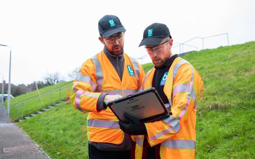 Development service staff working on tablet