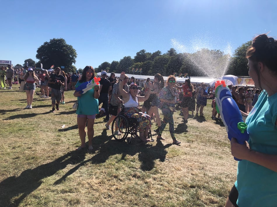 Bristol Water Bar volunteers spraying attendees with water guns  at Bristol Pride