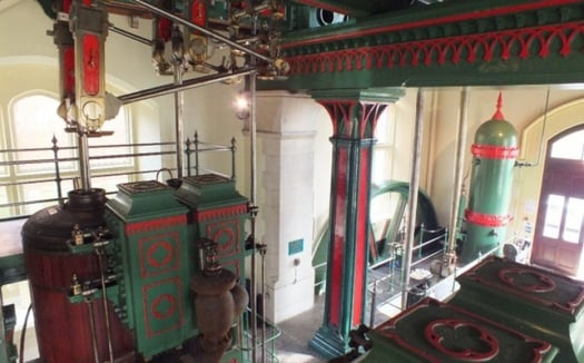 A green and red heritage water pump room in Blagdon. This was a heritage engineering project to restore the oldest water pump in bristol