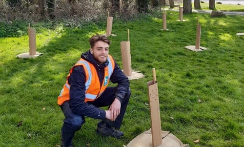Bristol Water employee alongside newly planted trees