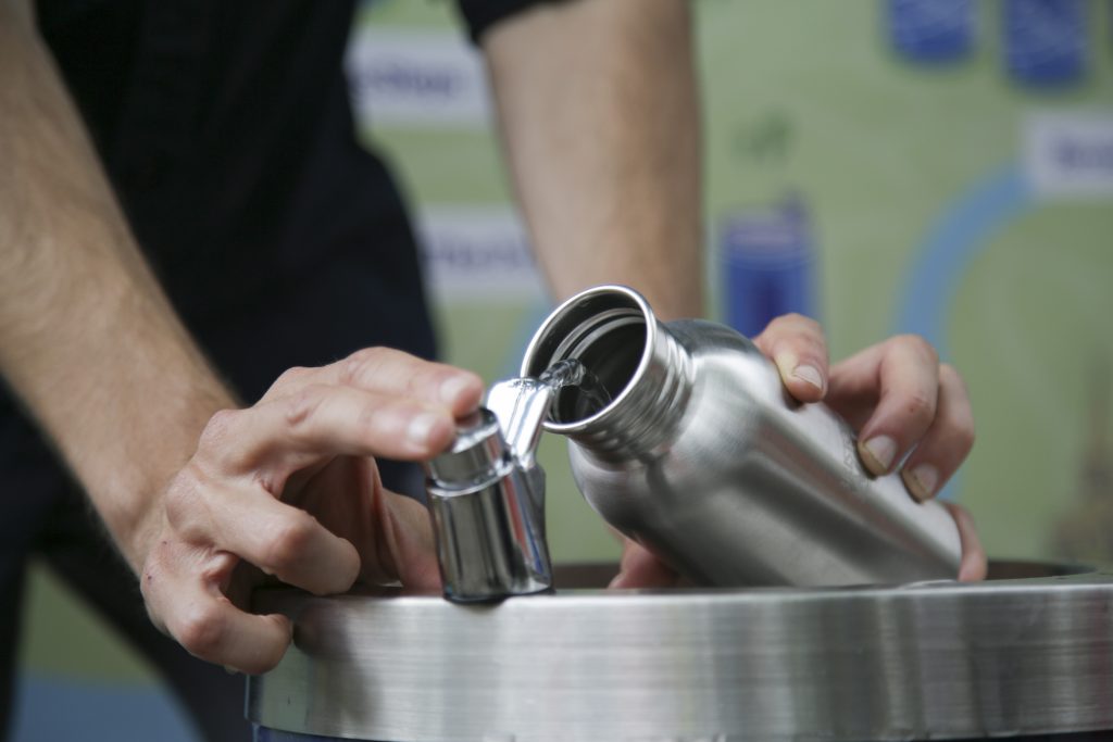 Filling a reusable water bottle 